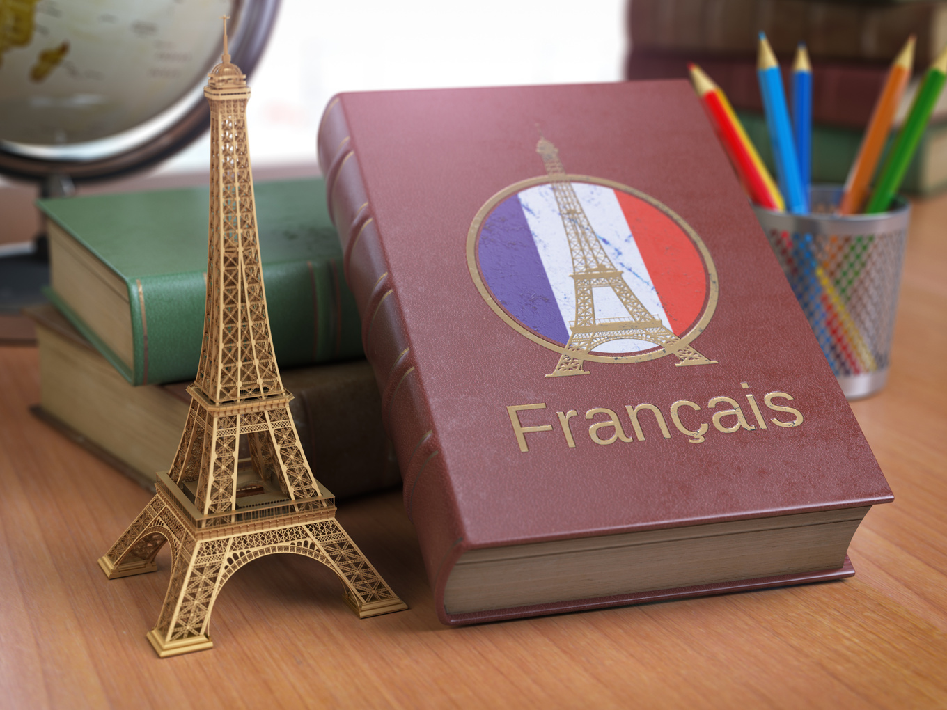 Learn and studiyng French concept. Book with  French flag and Ei